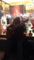 Street musician singing Zombie by The Cranberries (acoustic guitar)