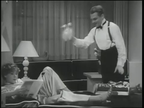 James Cagney shows Mae Clarke the door