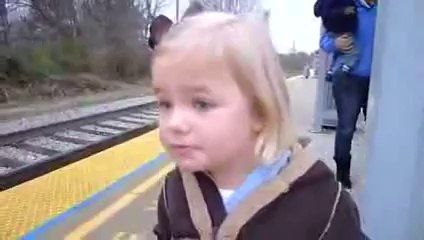 A little girl sees a train for the first time