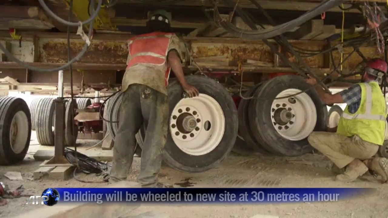 Workers put final touches to move building in DC