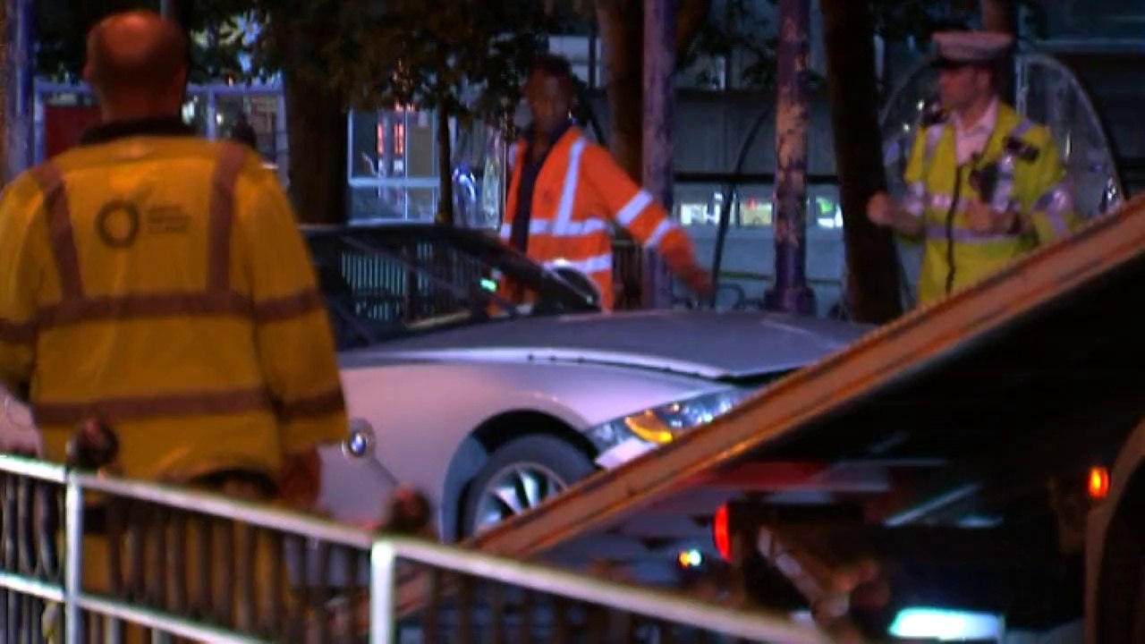 Car smashes through barrier into London subway
