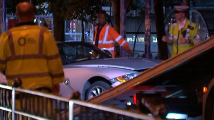 Car smashes through barrier into London subway