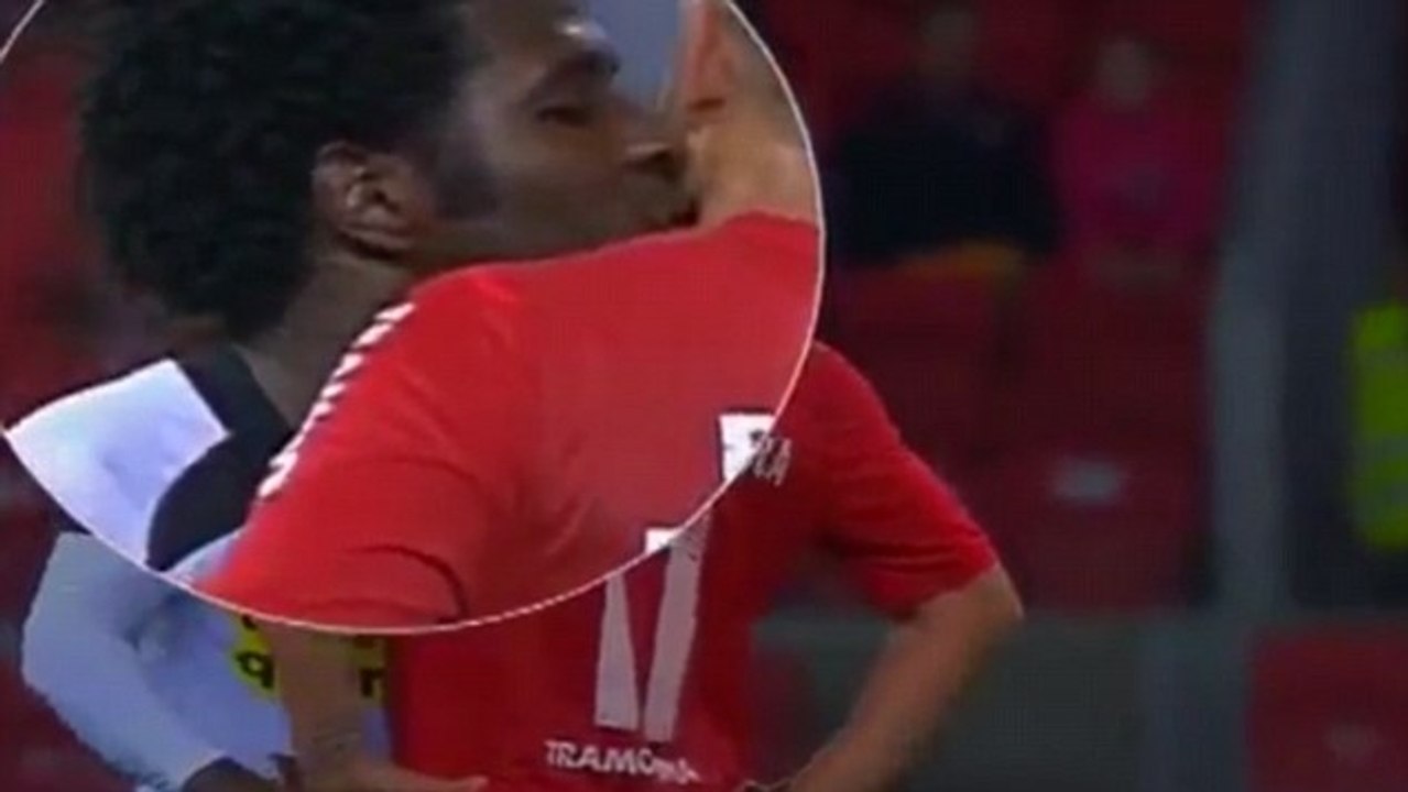 Brazilian defender Sandro gives angry striker a big sloppy kiss
