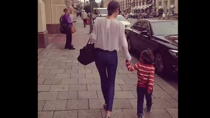 Miranda Kerr is bitten on her tummy by a handsome male model from her 7 For All Mankind campaign