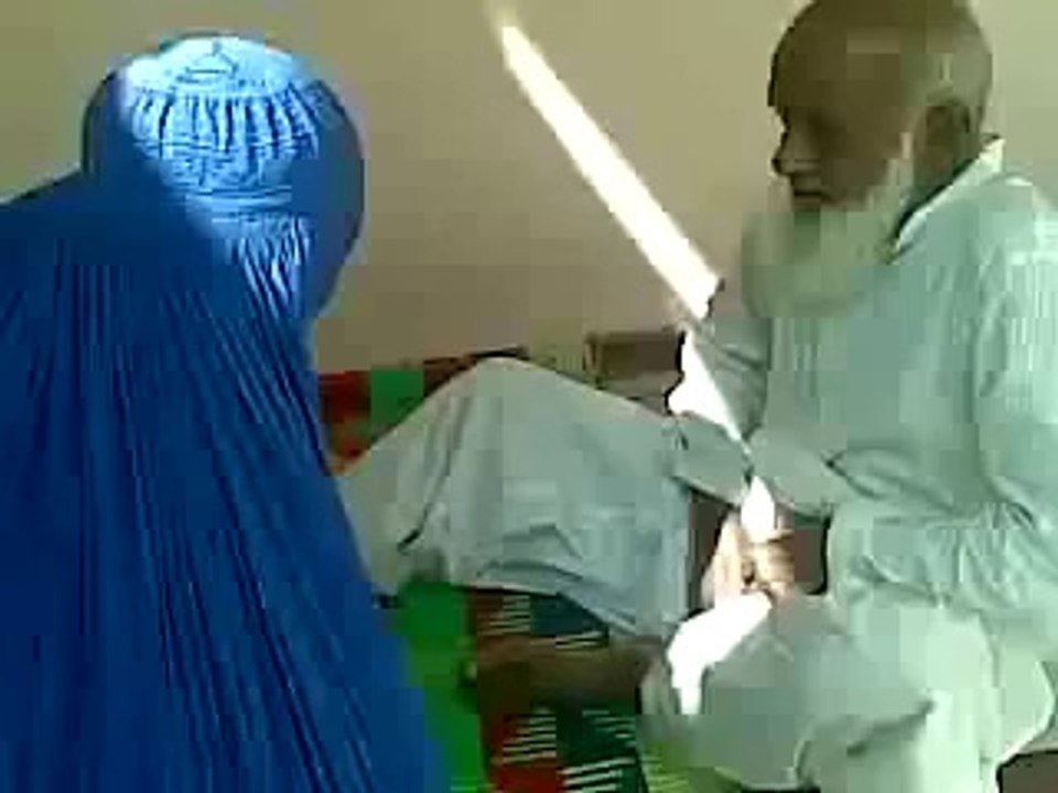 Fake peer doing idiotic acts with a woman-BloomPakistan