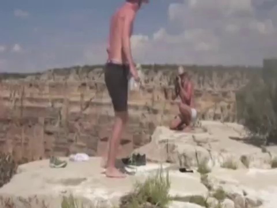 Cruel guys pushing a squirrel from the top of the Grand canyon!