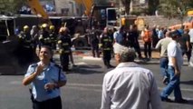 Israeli crowd cheers as dead assailant in Jerusalem attack is taken away
