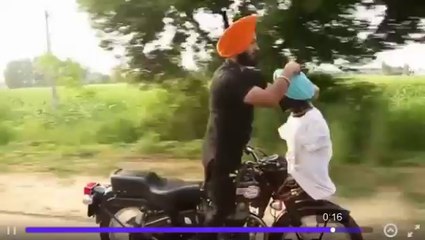 Singh Ties Turban While Driving Motorcycle