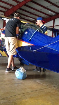 Patrick teaches young pilot about pitts S1SS Experimental plane