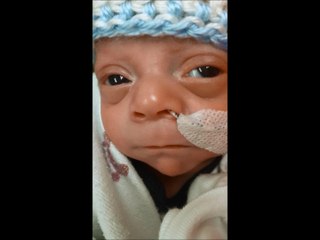 Newborn baby caught smiling for first time