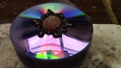 Red Hot Nickel Ball on a Stack of CDs