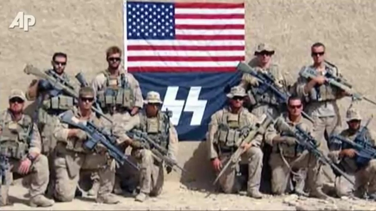 US troops pose with Nazi SS flag