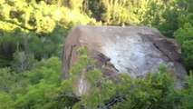 Move a giant rock of the road, from the top of a cliff. Trees killer!