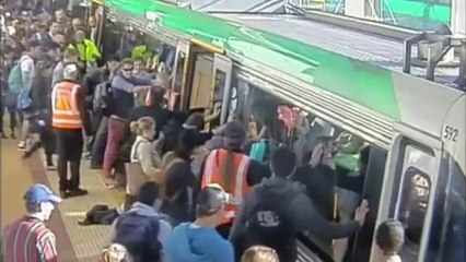 Subway passengers pushing train to free a man trapped by Perth train