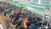 CCTV: Commuters push train to save trapped man in Perth