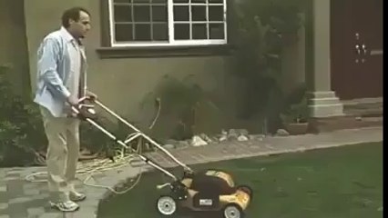 Cutting grass in his lawn