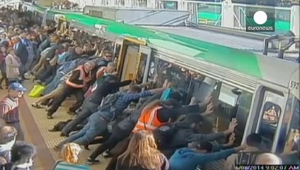 Australian commuters tilt train to free trapped man