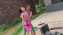 Girl Carries Polio-Stricken Friend To School For Four Years