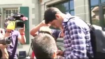 Luis Suarez pushes photographer out the way as he leaves court