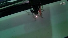 CNC laser cutting machine work on cardboard for cutting video