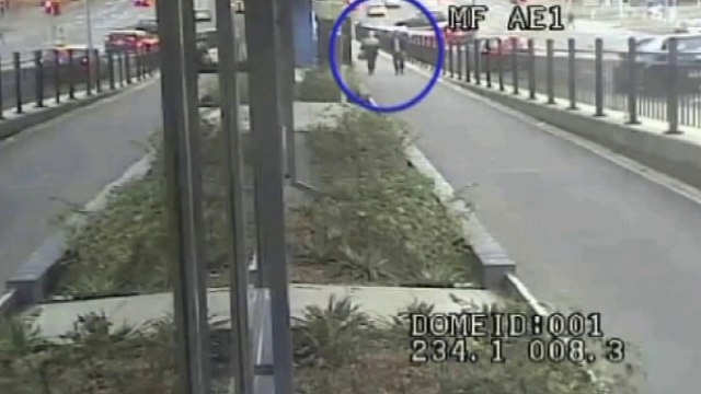 CCTV: Car misses pedestrians by inches after crash