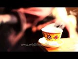 Ladakhi woman drinks butter tea