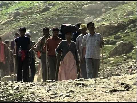 Amarnath pilgrims walk towards the holy cave
