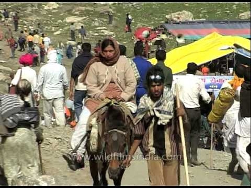 Pilgrims walking with stick, heading towards Amarnath cave