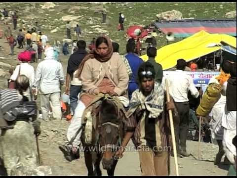 Pilgrims walking with stick, heading towards Amarnath cave