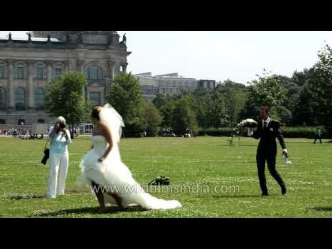 New bride in Berlin poses before the Reichstag, Germany