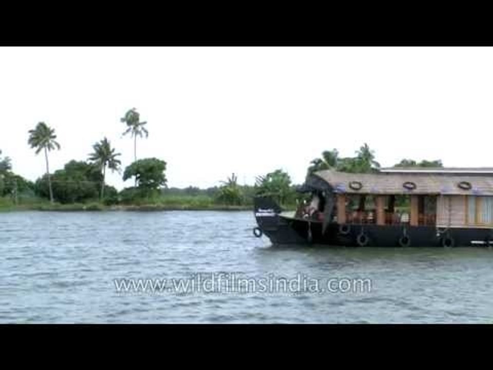 Houseboat cruises along cool tranquil backwaters of Kerala