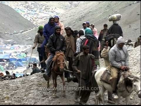 Pilgrims riding ponies on the way to Amarnath Cave