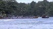 Participants rowing in ryhthm during Champakulam snake boat race - India