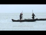 Local boatmen fishing in Vembanad Lake - Kerala