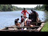 Volunteers carry sound system for the Champakulam boat race - Kerala