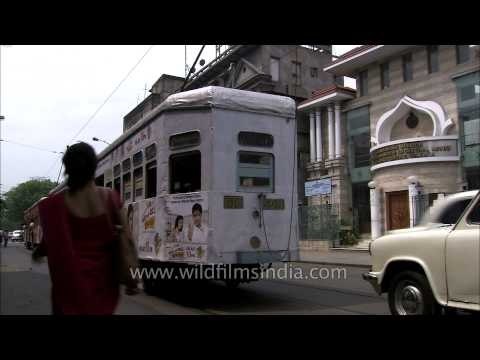 Traffic in Kolkata with buses and trams plying on roads