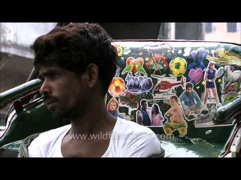 Line of hand-drawn rickshaw pullers wait for passengers - Kolkata