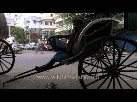 Kolkata still has hand-drawn rickshaws : cultural anachronism or inhuman transport?