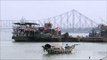 Ferries on river Hooghly against the backdrop of Howrah Bridge