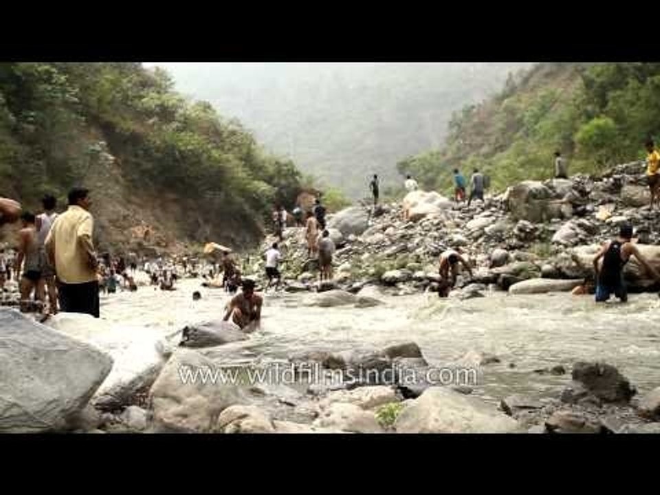 Village boys splashing around in River Aglar during Maund mela