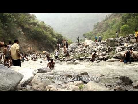 Village boys splashing around in River Aglar during Maund mela