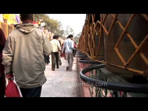 Devotees spinning prayer wheels at Mahabodhi Temple