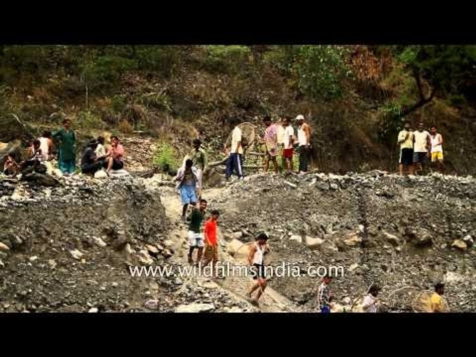 Villagers walk down to Aglar river to participate in Maund Mela
