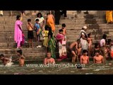 Holy bath in Ganges river by devotees - Varanasi