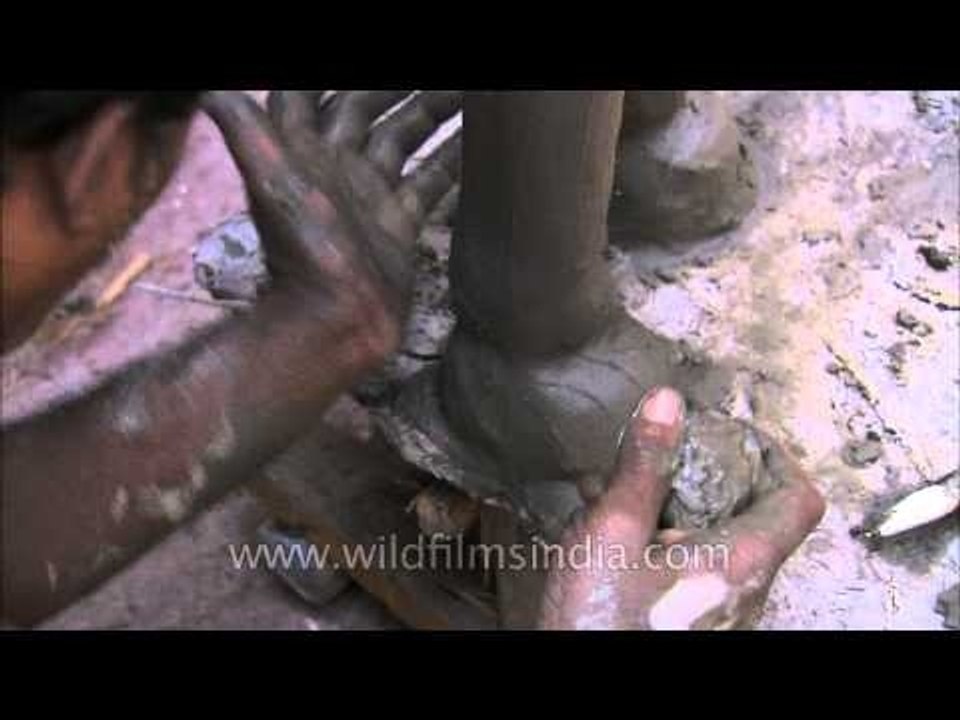 Artisan shaping clay idols - Kolkata