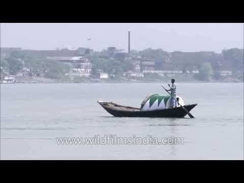 A man rowing boat on Hooghly River - Kolkata