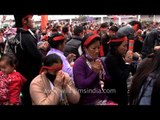 Tibetan pilgrims receive Buddhist teachings at the Kalachakra