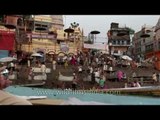 Varanasi Ganga ghat : temple bells tolling, conch shells sounding at evening arati