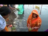 Hindu devotees perform rituals during Chhath Puja