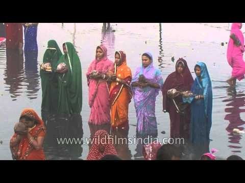 Women offer prayer during Chhath Puja - Delhi